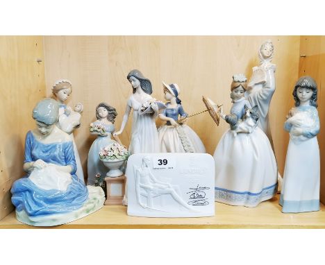 A collection of four porcelain Nao figures of girls, together with a Lladro collectors society plaque, and four further femal