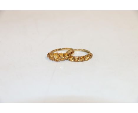 9k gold dress ring with 5 graduated amber coloured stones, size Q, and another similar, size Q, 4.6g goss. 