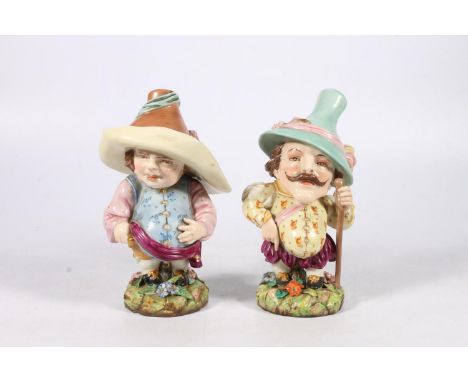 Two Royal Worcester porcelain figures of 'Mansion House Dwarf', one with purple backstamp, impressed '602 T4' 17cm tall. 