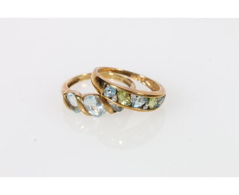 9k gold ring with three light blue stones, size P, and another size P, 5.6g gross. 