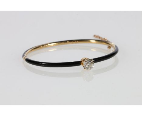 Gold and black enamel diamond set snap-shut bangle stamped Tiffany & Co, with safety chain, the single claw set diamond appro