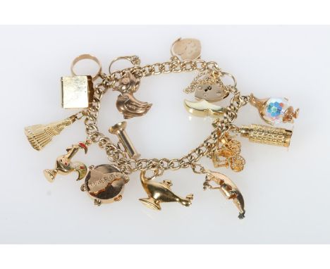 9ct gold curb link charm bracelet with fifteen yellow metal charms including Leaning Tower of Pisa, fan, penguin, gondola, Al
