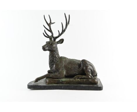 A bronze sculpture of a resting stag, mounted on a marble plinth, measuring approx. L39 x D16 x H39cmpossible belongs to C375