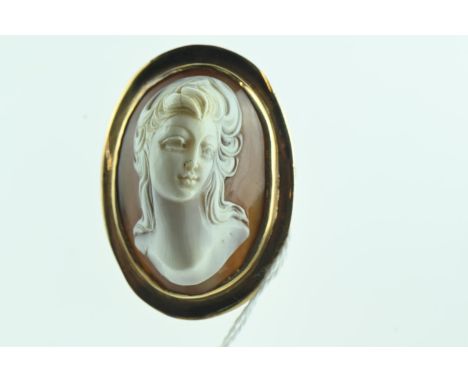 Yellow metal and cameo brooch, yellow metal tests positive for 14ct gold, length 43mm, gross weight 12.63 grams 