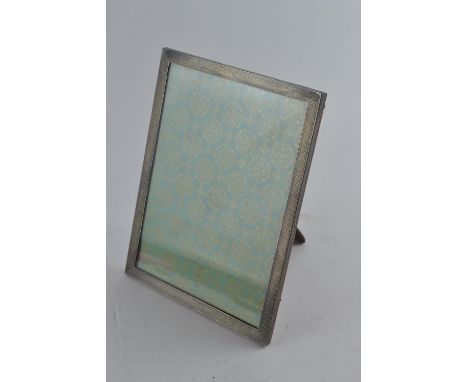 Silver rectangular engine-turned photo frame, maker's mark rubbed, Birmingham 1928, 22.5 x 17.5cm