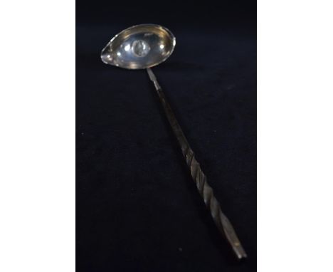 Georgian toddy ladle, the white metal bowl inset with a 1787 George III sixpence, the bowl engraved 'G W.M', with a twisted b