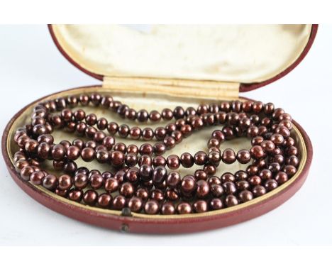 Long string of bronze cultured pearls. 1500mm circumference. Approx. diameters between 6-8cm. 