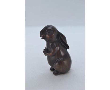Netsuke carved into a small Hare. H5.5 cm 
