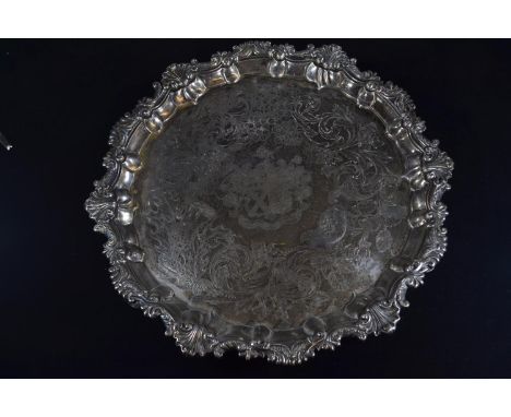 George IV silver footed salver, Paul Storr, London 1825, of circular form, engraved with central coats of arms with motto 'nu