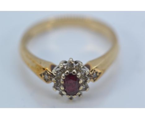 Ruby and diamond cluster ring mounted on 9ct gold, size N, gross weight 3 grams