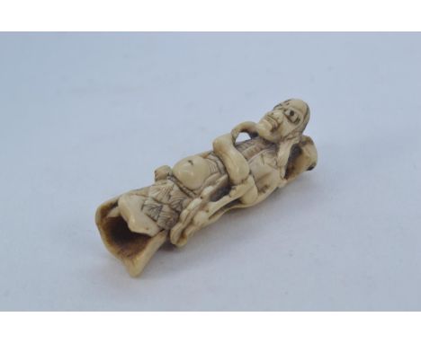 Japanese netsuke of Gama Sennin holding a toad, length 6.5cmApprox. 5mm crack to robe. Toad missing one bead eye. 