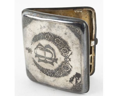 Iraqi white metal and niello cigarette case, the cover decorated with a harbour scene, the base with initials 'BP' within a w