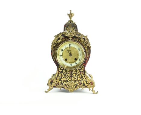 Ornate French Brevete clock with enamelled dial, diameter 12 cms, with key. Ht 36 cms, widest point 23 cmsSome small losses t