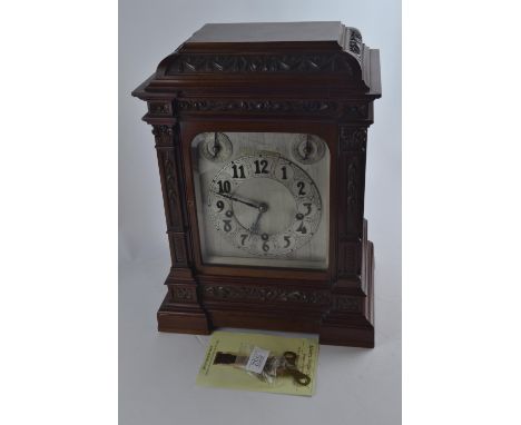 Large mantel/centre piece clock. Bristol goldsmiths alliance. Three dials to front with keys and pendulum. Ornately carved wi