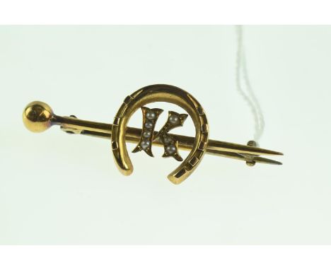 15ct gold and seed pearl brooch, designed as a bar centring the initial 'K' within a horseshoe, length 42mm, steel pin, gross