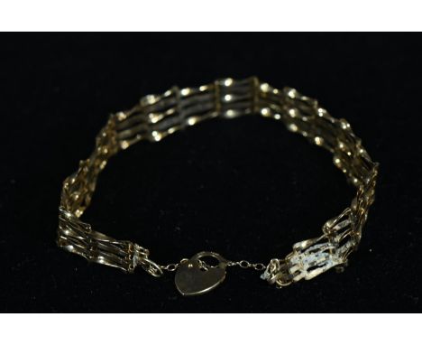 9ct gold gate link bracelet with heart-shaped padlock and safety chain, gross weight 4.09 grams