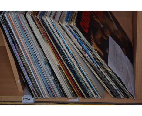 Approximately 50rock albums and15 x 12 inch singles . Inc, Queen, Doors, Bowie, The Rolling Stones, etc…, 