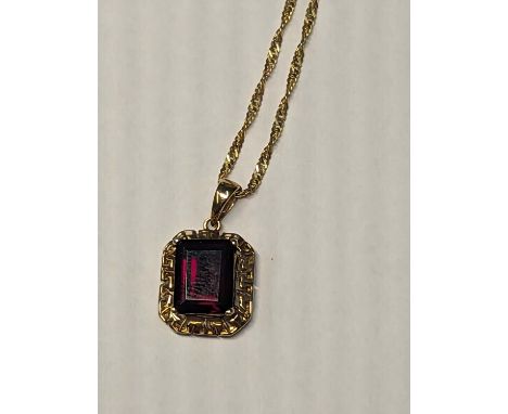 14ct gold chain with 14ct gold garnet set pendant. Circumference 460mm. Gross weight 3.24g