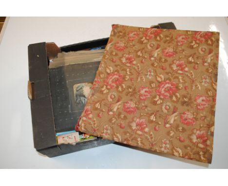 A box containing vintage postcard album with contents, scrap book, cricket photo album, football collector's cards including 