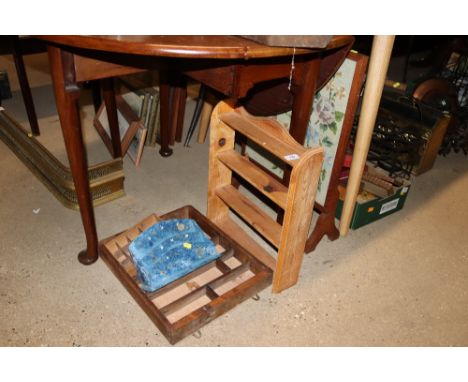Two pine hanging shelves; a blue painted and decorated stationery rack, a wool work fire screen