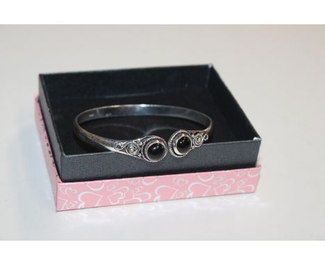 A 925 silver and black onyx bangle 