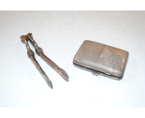 A silver cigarette case, 74gms and a pair of nutcrackers 