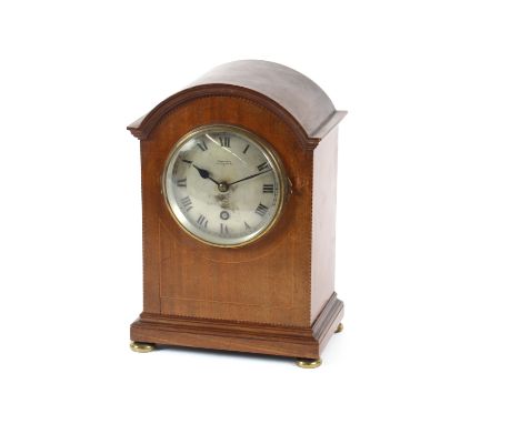 An Edwardian inlaid mantel timepiece by Frederick Dixon, Oxford Street, the domed case raised on brass disc feet, approx. 29c