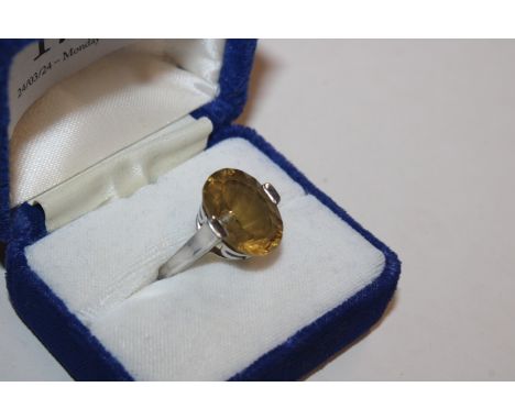 A vintage Sterling silver dress ring, with approx. 16mm x 12mm citrine, size J/K, 6gms 