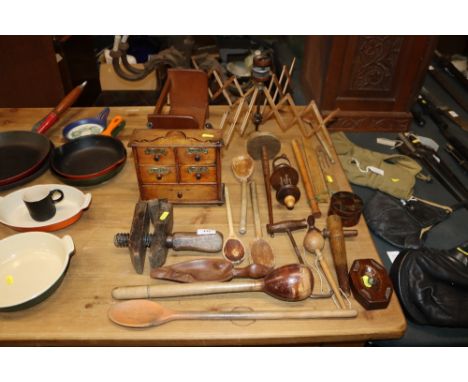 A quantity of various wooden items to include book trough, wool winder, wooden clamp, spice nest of drawers, various spoons, 