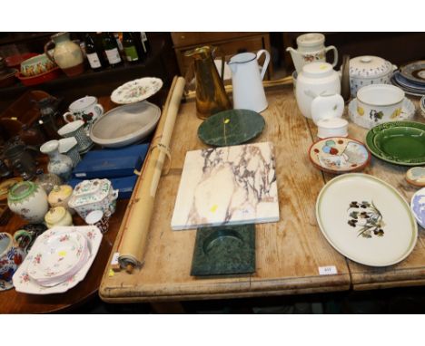 A stone ash tray, a marble Lazy Susan, a marble chopping board, a brass jug and an enamel jug 