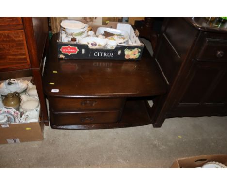 An Ercol coffee table fitted two drawers 