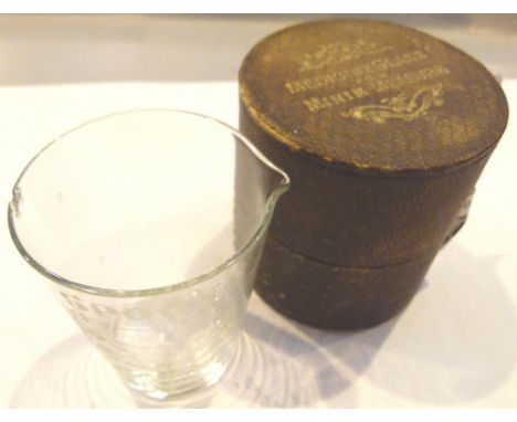 Vintage medicine measuring glass