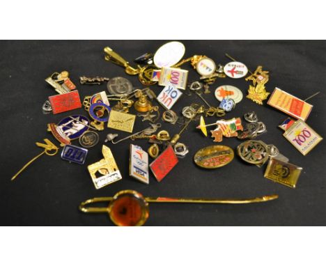 A collection of enamel pin badges