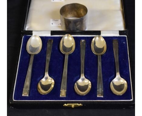 A set of six Art Deco silver teaspoons, geometric terminals, gilt bowls, hallmarked, cased en suite; a silver napkin ring, ha