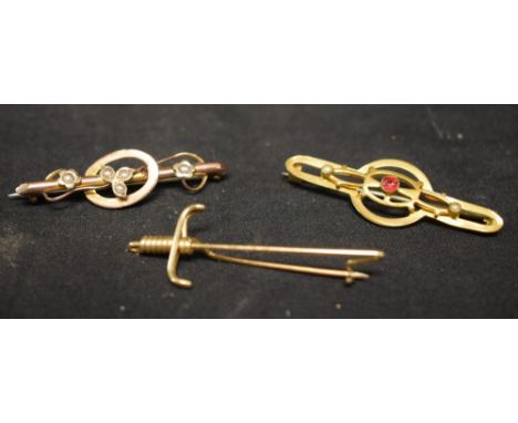 A Victorian 9ct gold seed pearl inset tubular bar brooch, stamped 9ct, others yellow metal wirework Sword, etc (3)