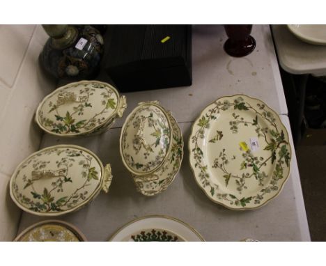 An oriental ivory china meat plate together with two matching tureens and sucrier on stand, retailed by Maple &  Co.