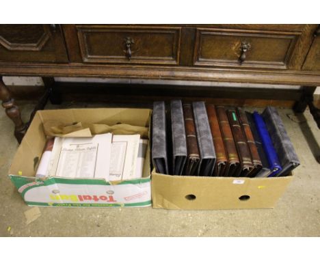 A box of empty stamp albums and stamp album refills