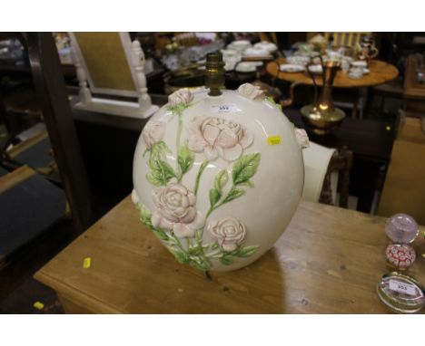 An Italian pottery and rose decorated table lamp and shade