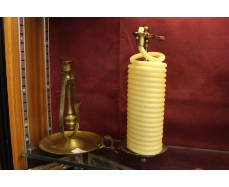 A wax jack; together with a brass candlestick