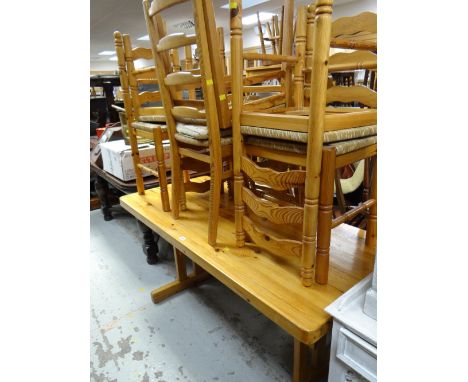 A modern farmhouse pine dining table & six ladder back rush seated chairs