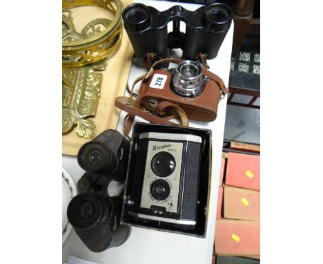A vintage Halina Anastiget 35X camera, a Brownie Reflex camera in original box & two pairs of old binoculars