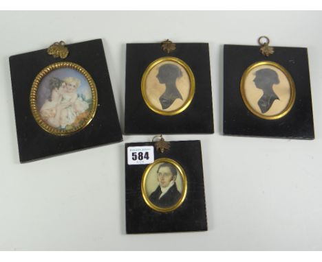 An oval miniature portrait of a Georgian gentleman with white scarf together with a pair of miniature oval silhouettes & a be