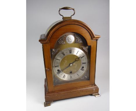 A good Elliott reproduction dome-topped & engraved brass face bracket clock with silver dial bearing Roman numerals on metall