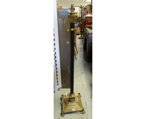 A Corinthian-type architectural antique standard lamp with stepped brass platform base.condition:Yes the lamp is adjustable.