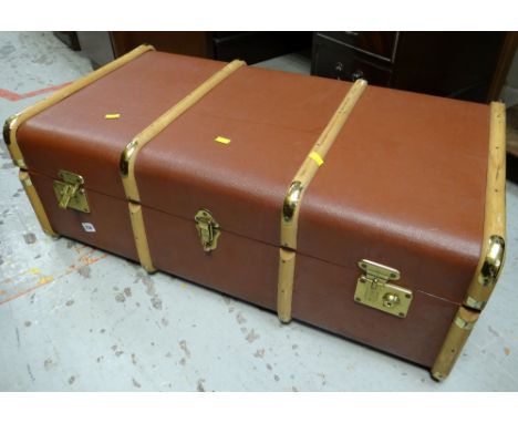 A modern wooden banded steamer trunk with brass fittings