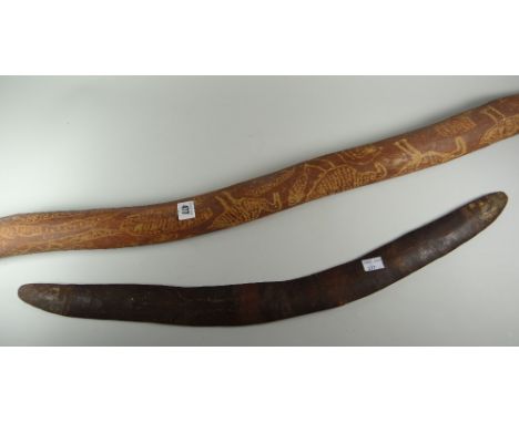 An Aboriginal didgeridoo & boomerang, the didgeridoo with scratched emu & snake decoration, the boomerang with faded spots de