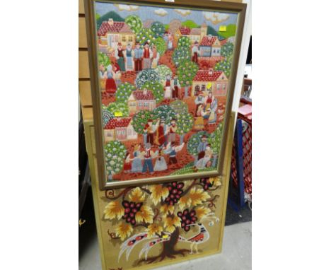 A framed tapestry in the folk style with numerous figures playing instruments and dancing,  plus a framed floral similar