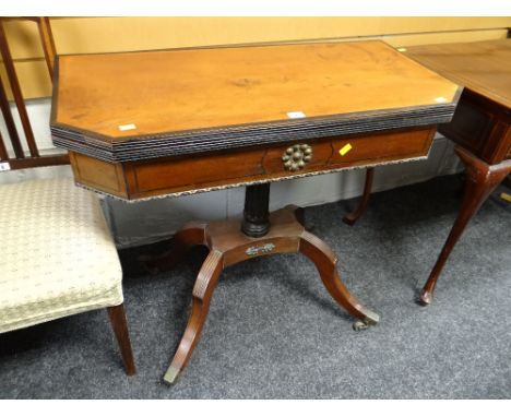 An antique foldover baize lined card table with ebony stringing &amp; metallic mounts