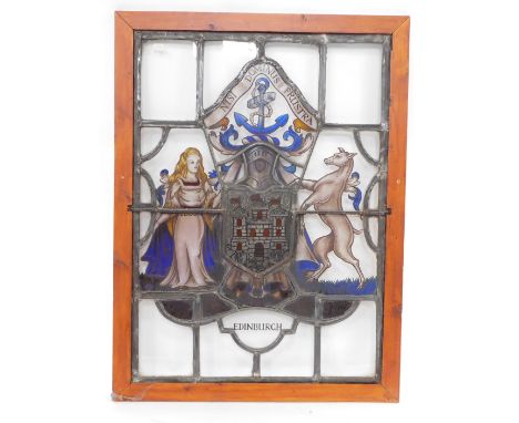 A stained glass window panel, pine framed, bearing the Coat of Arms and Motto of the City of Edinburgh, 85cm high, 61cm wide.