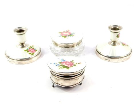 A cut glass silver and guilloche enamel four piece dressing table set, painted with roses against a white ground, comprising 